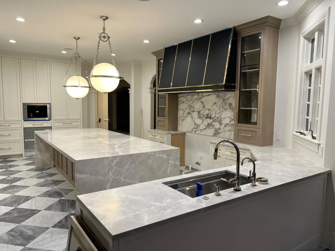 An alternate view of the kitchen remodel, showing the island and separate cooktop counter.